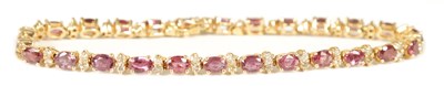 Lot 248 - A LADIES 14CT YELLOW GOLD RUBY AND DIAMOND TENNIS BRACELET