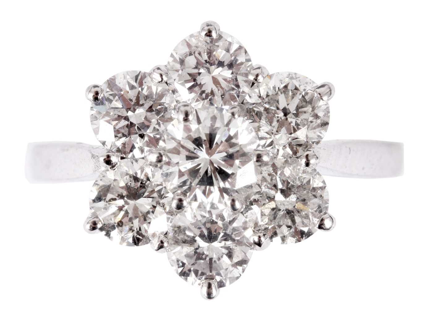 Lot 207 - A LADIES 18CT WHITE GOLD SEVEN STONE MODERN...