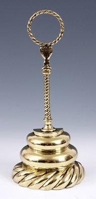 Lot 281 - A VICTORIAN BRASS DOOR STOP of stepped rounded...