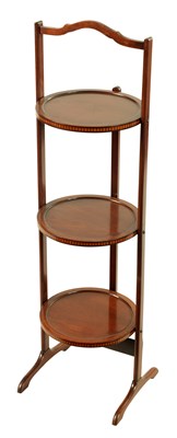 Lot 1213 - AN EDWARDIAN MAHOGANY THREE TIER FOLDING CAKE STAND