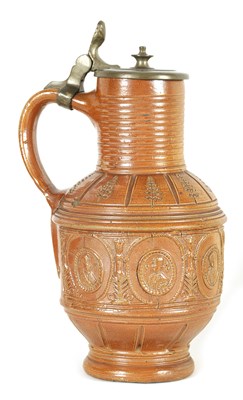 Lot 72 - A LATE 16TH CENTURY GERMAN BROWN SALT GLAZED STONEWARE JUG DATED 1598 WITH HINGED PEWTER COVER