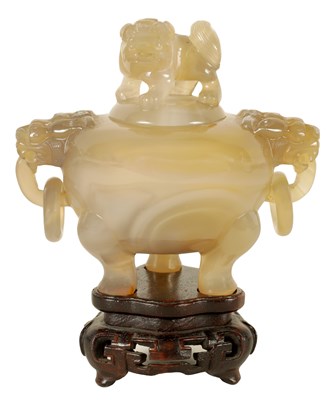 Lot 130 - A CHINESE AGATE KORO AND COVER ON STAND