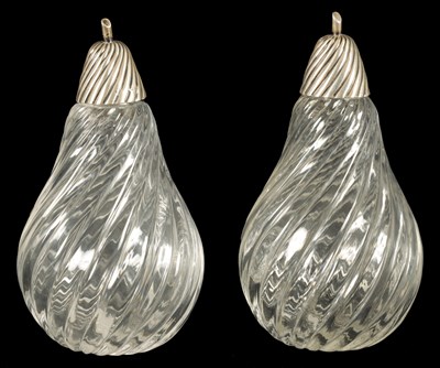 Lot 330 - A PAIR LATE 19TH CENTURY CUT GLASS SILVER TOPPED SENT BOTTLES