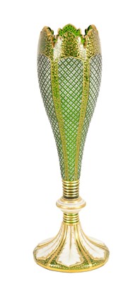 Lot 19 - A 19TH CENTURY BOHEMIAN GREEN GLASS AND WHITE OVERLAY GILT VASE
