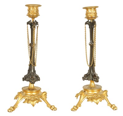Lot 621 - A PAIR OF LATE 19TH CENTURY FRENCH BARBIDIENNE STYLE BRONZE AND ORMOLU CANDLESTICKS