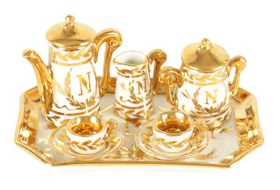 Lot 71 - AN EARLY 20TH CENTURY MINIATURE LIMOGES PORCELAIN FRENCH NAPOLEON TEA SERVICE