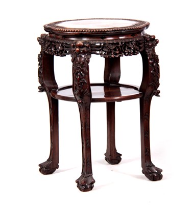 Lot 212 - A 19TH CENTURY PROFUSELY CARVED CHINESE HARDWOOD CIRCULAR JARDINIERE STAND