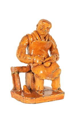 Lot 72 - A MID 19TH CENTURY PILL POTTERY WELSH REDWARE GLAZED EARTHENWARE FIGURE
