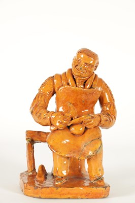 Lot 68 - A MID 19TH CENTURY PILL POTTERY WELSH REDWARE GLAZED EARTHENWARE FIGURE