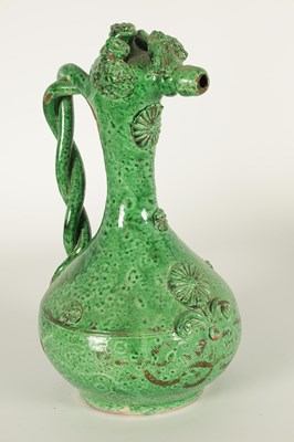 Lot 37 - AN OTTOMAN REVIVAL TURKISH GREEN GLAZED TERRACOTTA CANAKKALE EWER