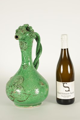 Lot 37 - AN OTTOMAN REVIVAL TURKISH GREEN GLAZED TERRACOTTA CANAKKALE EWER