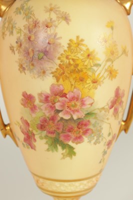 Lot 52 - AN ORNATE ROYAL WORCESTER GILT AND IVORY GROUND SCROLLED TWO-HANDLED CABINET VASE AND COVER