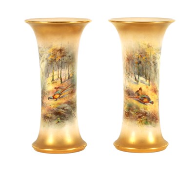 Lot 40 - JAMES STINTON. A PAIR OF ROYAL WORCESTER GILT EDGED FLARED CYLINDRICAL CABINET VASES
