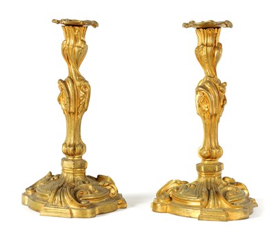 Lot 503 - A PAIR OF 19TH CENTURY FRENCH ROCOCO CAST GILT ORMOLU CANDLESTICKS