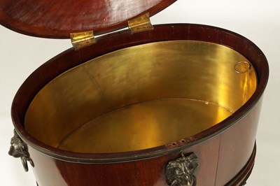 Lot 1061 - A GOOD GEORGE III OVAL MAHOGANY CELLARETTE