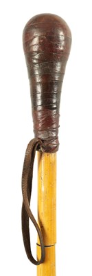 Lot 459 - AN EARLY 20TH CENTURY BAMBOO AND LEATHER DAGGER STICK