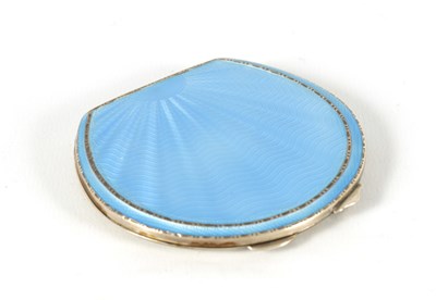 Lot 290 - A GEORGE VI SILVER AND GUILLOCHE ENAMEL HORSESHOE SHAPED COMPACT