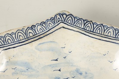 Lot 81 - AN 18TH/19TH CENTURY DELFT BLUE AND WHITE SHAPED SHALLOW DISH