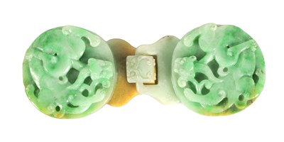 Lot 114 - A 19TH CENTURY CHINESE GREEN JADE CARVED BELT BUCKLE