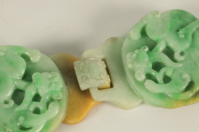 Lot 151 - A 19TH CENTURY CHINESE GREEN JADE CARVED BELT BUCKLE
