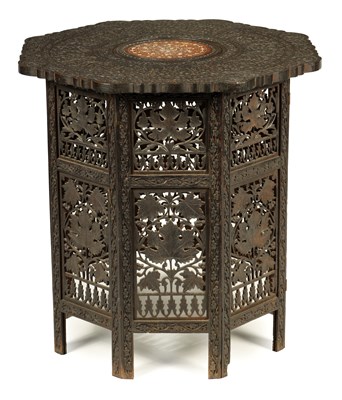 Lot 100 - A 19TH CENTURY CARVED HARDWOOD ANGLO-INDIAN FOLDING OCCASIONAL TABLE PROBABLY BURMESE