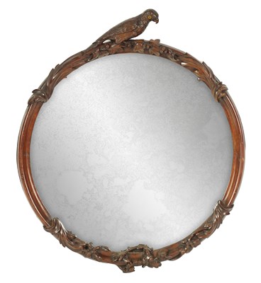 Lot 1109 - A 19TH CENTURY CARVED PADUK CIRCULAR HANGING MIRROR