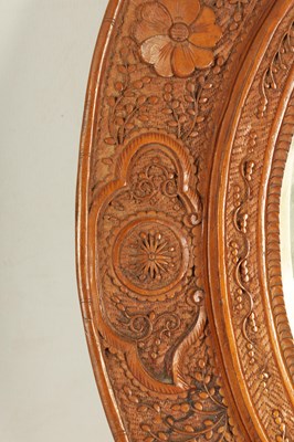 Lot 129 - A PAIR OF LATE 19TH CENTURY CHINESE CARVED BOXWOOD OVAL MIRRORS