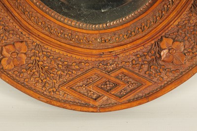 Lot 129 - A PAIR OF LATE 19TH CENTURY CHINESE CARVED BOXWOOD OVAL MIRRORS