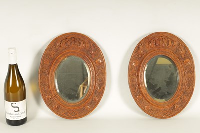 Lot 129 - A PAIR OF LATE 19TH CENTURY CHINESE CARVED BOXWOOD OVAL MIRRORS