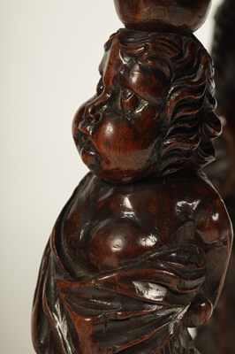 Lot 1081 - A GOOD PAIR OF CHARLES II CARVED WALNUT CIRCULAR UPHOLSTERED STOOLS