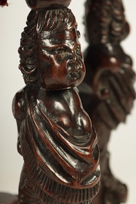 Lot 1081 - A GOOD PAIR OF CHARLES II CARVED WALNUT CIRCULAR UPHOLSTERED STOOLS