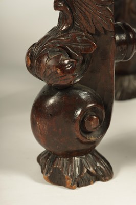 Lot 1081 - A GOOD PAIR OF CHARLES II CARVED WALNUT CIRCULAR UPHOLSTERED STOOLS
