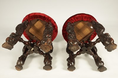 Lot 1081 - A GOOD PAIR OF CHARLES II CARVED WALNUT CIRCULAR UPHOLSTERED STOOLS