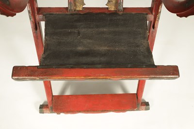 Lot 188 - AN 18TH/19TH CENTURY JAPANESE RED LACQUER WORK AND ENGRAVED BRASS MOUNTED HORSESHOE BACK FOLDING HUNTING CHAIR