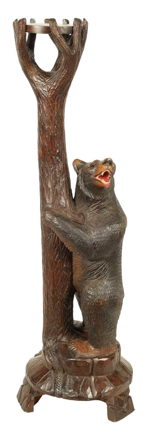 Lot 565 - A 19TH CENTURY LINDEN WOOD BLACK FOREST CARVED BEAR JARDINIERE STAND