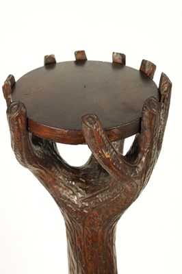 Lot 565 - A 19TH CENTURY LINDEN WOOD BLACK FOREST CARVED BEAR JARDINIERE STAND