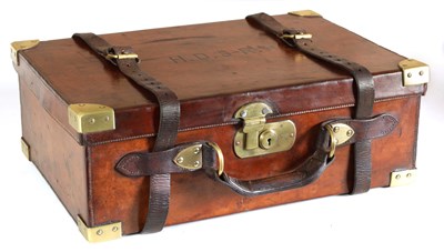Lot 661 - AN EARLY 20TH CENTURY BRASS BOUND LEATHER SHOTGUN CARTRIDGE CASE