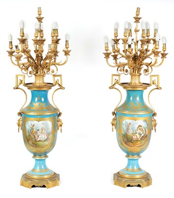 Lot 603 - A FINE AND MONUMENTAL PAIR OF FRENCH 19TH CENTURY GILT OROMLU AND SERVES PORCELAIN FLOOR STANDING VASE SHAPED CANDELABRA