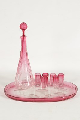 Lot 31 - AN ART NOUVEAU RUBY AND CLEAR GLASS MOSER DECANTER, TRAY AND SIX GLASSES