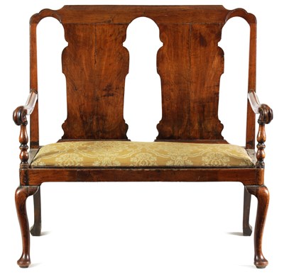 Lot 680 - A GEORGE I FIGURED WALNUT TWO SEATER SETTEE