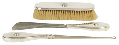 Lot 295 - AN ART NOUVEAU SILVER DRESSING TABLE SET WITH RUSKIN JEWELS