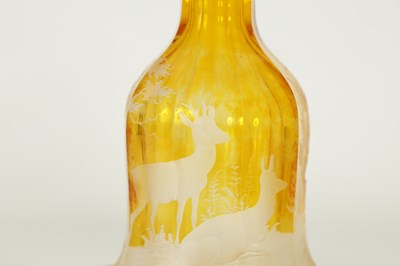 Lot 23 - A FINE PAIR OF 19TH CENTURY BOHEMIAN AMBER FLASHED GLASS DECANTERS