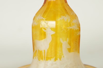 Lot 23 - A FINE PAIR OF 19TH CENTURY BOHEMIAN AMBER FLASHED GLASS DECANTERS