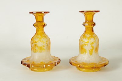 Lot 23 - A FINE PAIR OF 19TH CENTURY BOHEMIAN AMBER FLASHED GLASS DECANTERS