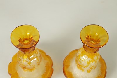Lot 23 - A FINE PAIR OF 19TH CENTURY BOHEMIAN AMBER FLASHED GLASS DECANTERS
