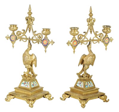 Lot 679 - A PAIR OF LATE 19TH CENTURY BRASS AESTHETIC PERIOD DOUBLE BRANCH CANDELABRA
