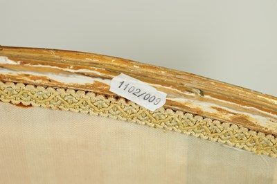 Lot 1399 - A PAIR OF GEORGE III ENGLISH CARVED GILTWOOD HEPPLEWHITE STYLE UPHOLSTERED SETTEES