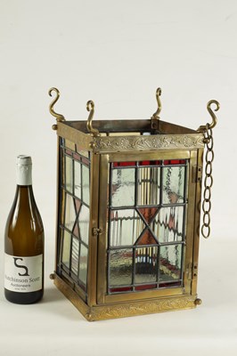 Lot 611 - A LATE 19TH CENTURY BRASS AND STAINED GLASS HALL LANTERN
