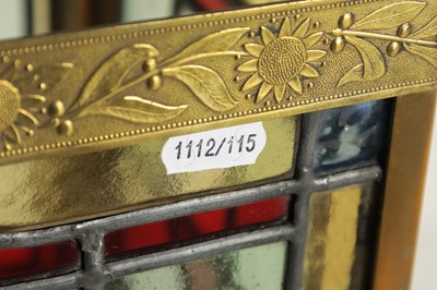 Lot 611 - A LATE 19TH CENTURY BRASS AND STAINED GLASS HALL LANTERN