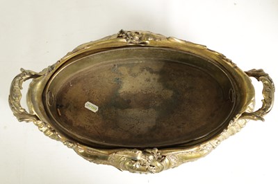 Lot 609 - A 19TH CENTURY FRENCH CAST GILT METAL RECOCO STYLE OVAL TWO-HANDLED SHALLOW JARDINERE AND LINER